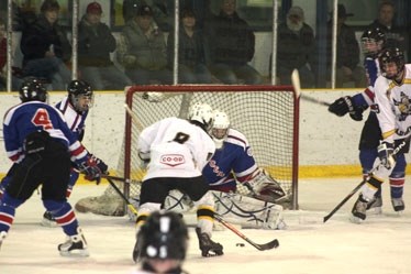 Steelers forward Austin Caldwell drives one in the net during game three of the NAMHL championship series March 27 at the Agrena. The Steelers took a 3-0 lead less than 10
