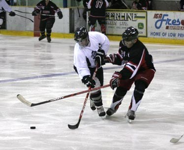 Westlock&#8217;s Brett Cooper tries to get around a High Prairie defender in the &#8216;A&#8217; final Sunday afternoon.