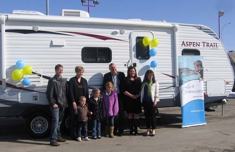 Pictured (left to right) are Wes Werkman, his wife Gloria holding Saige&#8217;s hand, Sierra, Hailey, Spruce Grove RV general manager Doug Ross, CWF associate director Anna