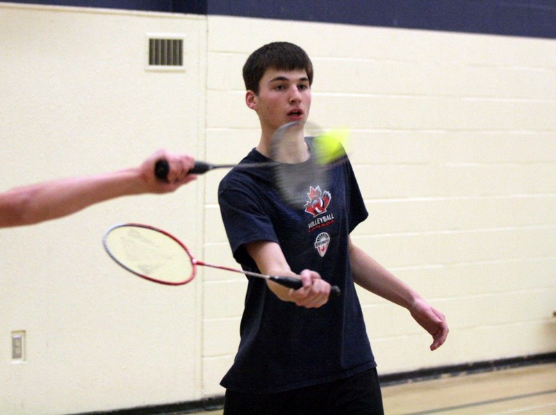 Justin Koch reaches for the birdie during April 17 practice at BCHS.