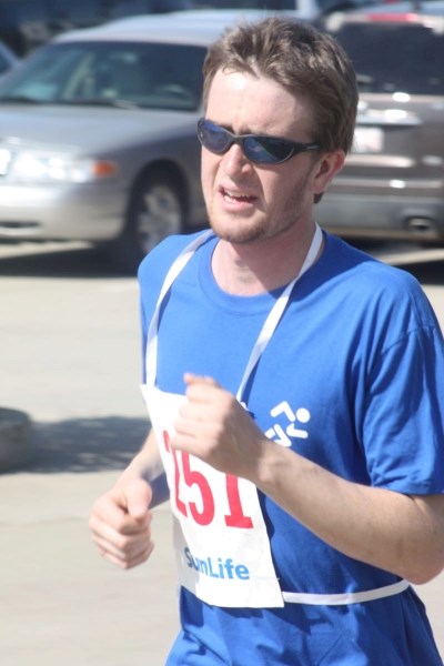 Richard Ellens powers to the finish line during Saturday&#8217;s community run. It was his third victory in the event.