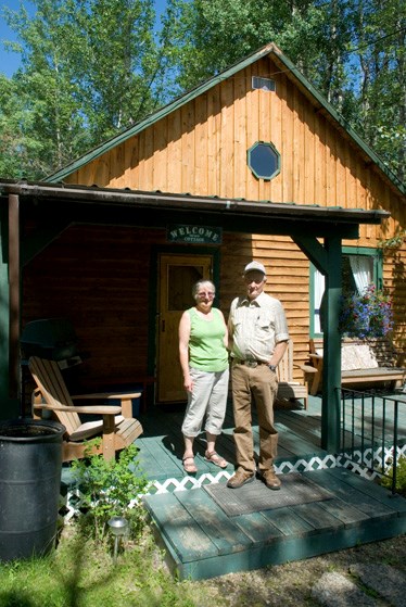 Shirl and Don Westendorf stand outside the cottage they have available for those looking for a quiet getaway at Bar 6 Country Retreat. The retreat has a dog kennel, walking