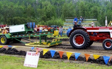 About 54 tractors entered the Sangudo Farmers Day tractor pull on June 9 and 10. Rain and mud made for challenging conditions.