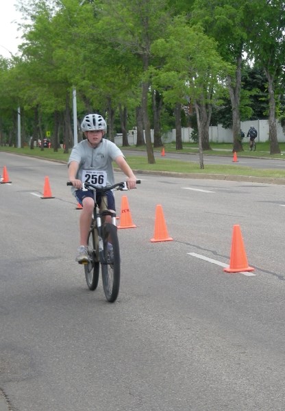 Pedal power: Harrison Fisher cycling, one of the three disciplines he will be performing at the Summer Games.