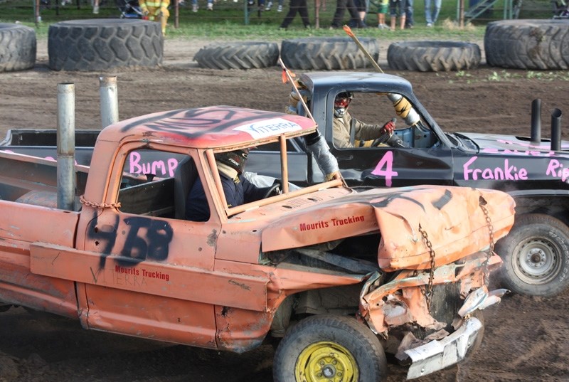 It&#8217;s crunch time yet again at the Demolition Derby. Mike Driessen (in the far truck) is seen in the thick of the action.