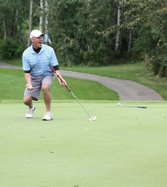 Did you see it go in the hole? Kurt Rawluk shows his delight on the green of the 8th on Sunday.