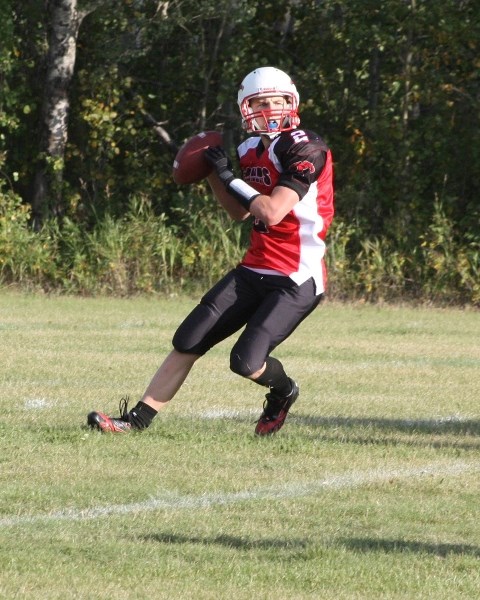 T-Birds &#8216; Brett Snell in action in Friday &#8216;s season opener in Athabasca. T-Birds lost 32-6.
