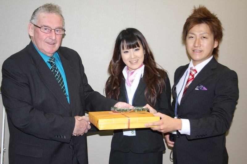 A gift from Japan: Barrhead twinning committee chairman Roy Ulmer receives a gift from Shiina Tamura and Norihiro Maehata.