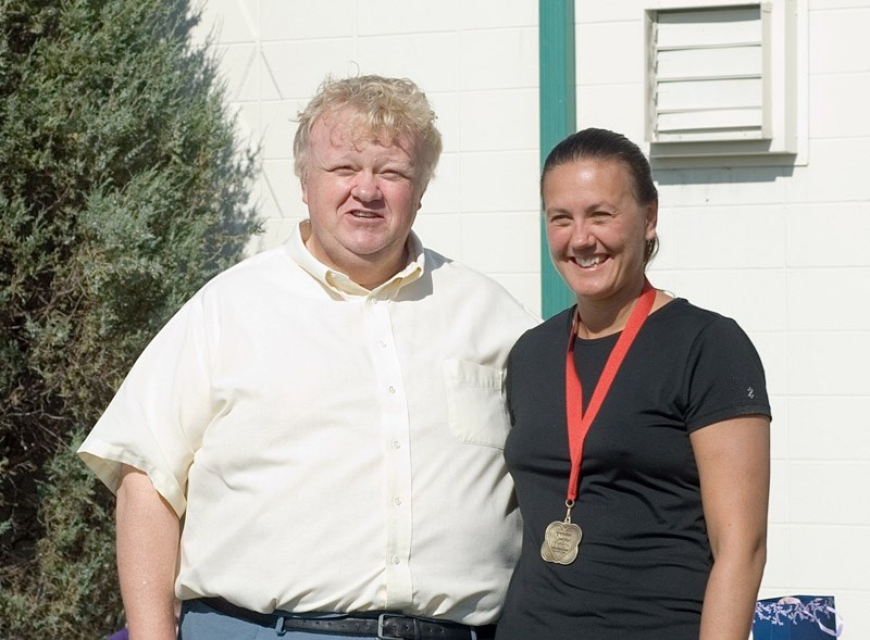 Mayor Brian Schulz stands with Barbara Petryshen-Kozak from Spruce Grove, who placed first overall in the triathlon with a time of 1:25:40.