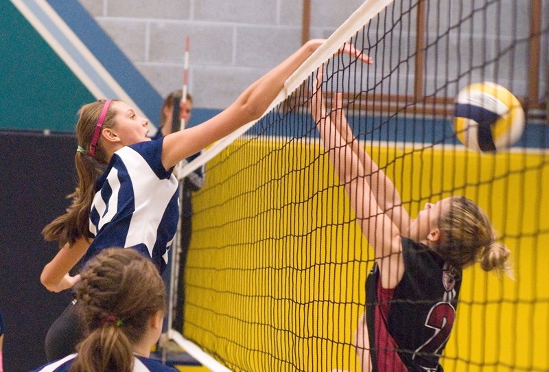 Feikje Deinum makes a great jump to block the ball and send it back over to the opposing side during the tournament over the weekend.