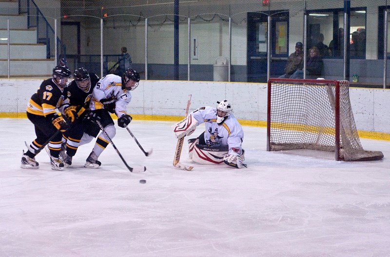 Barrhead Steelers goalie Dylan Geiger prepares to make a save, as teammate Scott Westerland fends off two oncoming Strathcona Warriors Friday, Nov. 2. The Steelers claimed a