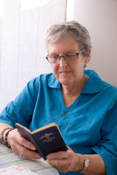 Barrhead resident Adrienne Campbell looks through father William Love &#8216;s war diary from World War II. Campbell was only three when Love shipped out to North Africa.