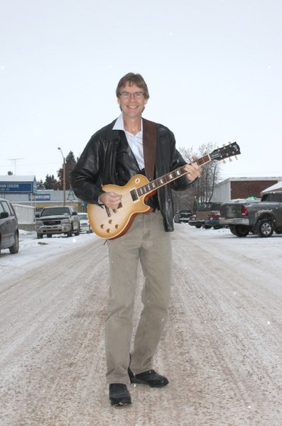 On a musical journey: Ron Ketchum likes to travel everywhere with his guitar. His debut CD will be available at local retail outlets.