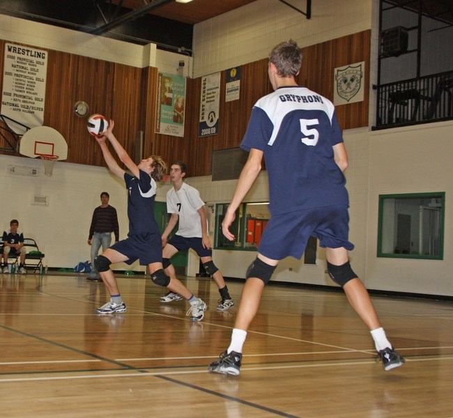 The Gryphons &#8216; Eli Nanninga (6) strikes the ball as Travis Storchinski (7) and Mark Fountain (5) look on in Athabasca last weekend.