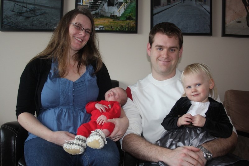 We are family: Rachel and Brian Rowland with baby Terence, now eight days old. The arrival of Barrhead &#8216;s New Year &#8216;s Baby was the perfect way for the family to
