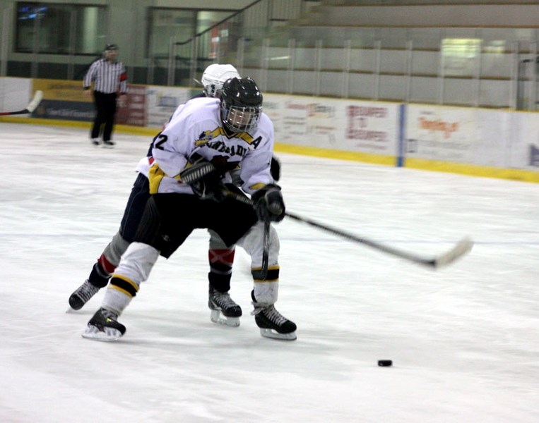 The Renegades &#8216; Aaron Wharton shields the puck from a Sturgeon player during Saturday night &#8216;s encounter at the Agrena.