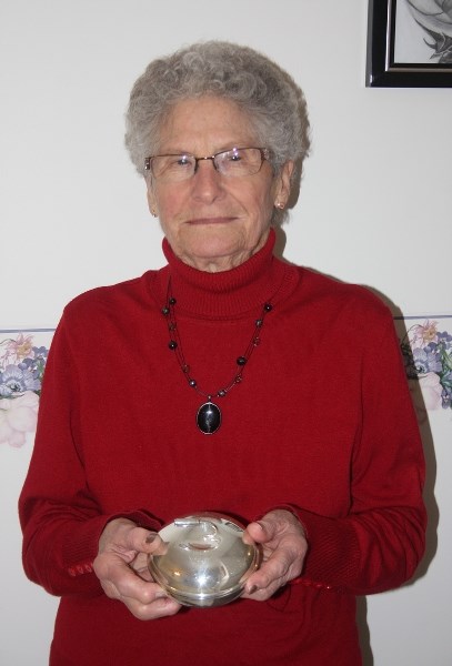 Jean Smith with the silver dish she received after her team got an 8-ender in 1968.