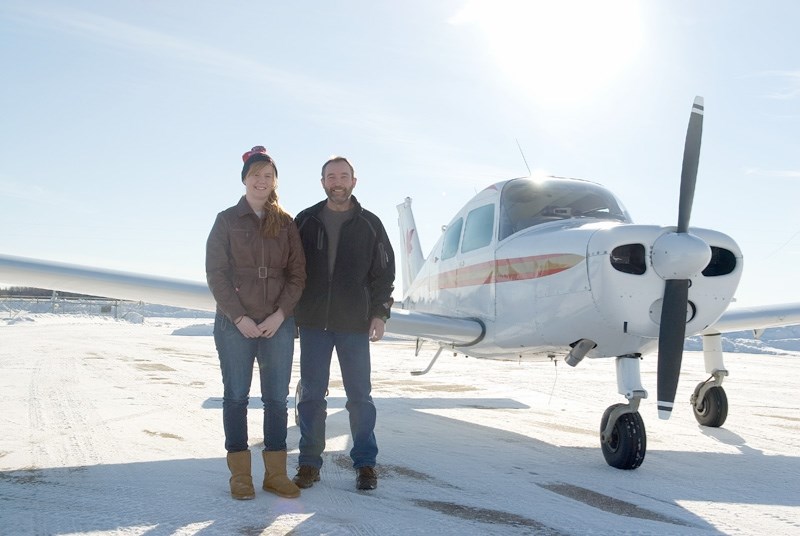 Grade 12 student Bonnie Vandermeulen stands with pilot Barry Holland after the two flew from the Barrhead Airport, to Fort Assiniboine, to Edmonton then back in the