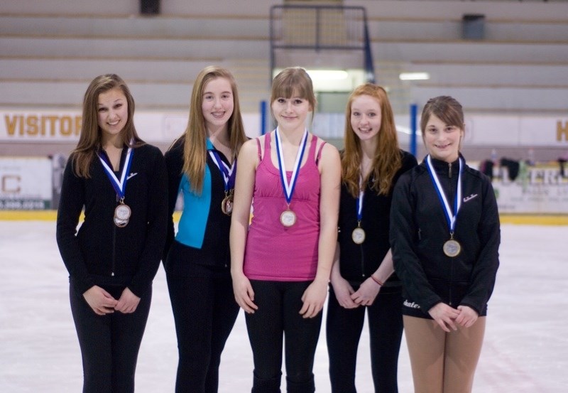 Barrhead figure skaters Deanna Klein, Katie Magill, Shaylynn Sanderson, Amanda Horner and Emma Albers wear the medals they won at a competition in Grand Prairie. Missing