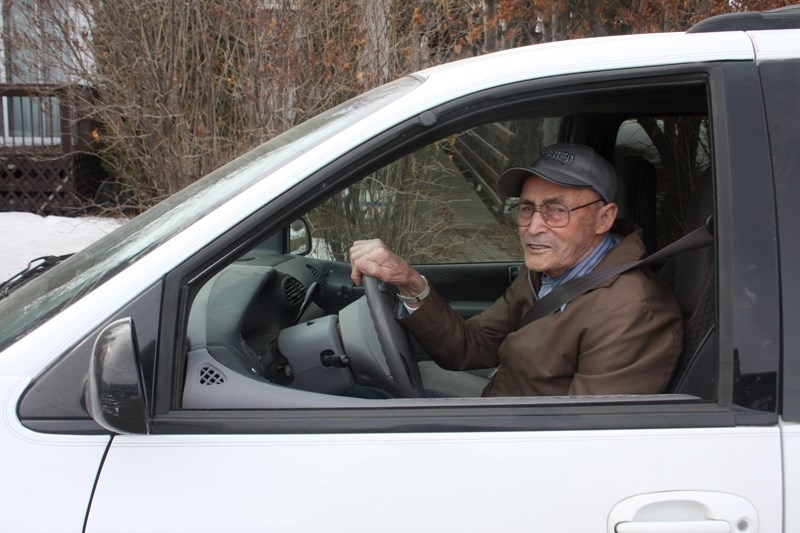Doug Gibb pictured in his white Dodge. The 92-year-old Klondike Place resident is willing to take wheelchair users around town.