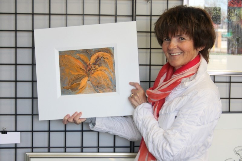 Barrhead Art Club president and artist of the month Jo Ann Nanninga with her painting &#8220;Fluttering, &#8221; which is displayed at the art gallery.
