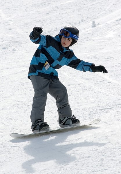 Phillip Taylor makes his way down the slopes during the last day of the season at Misty Ridge Ski Hill March 31.