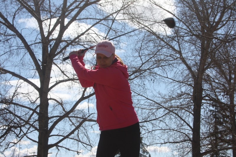 Driving off: Assistant manager Mariet Kosterbok gets back into the golfing groove after the long winter. Last weekend saw temperatures soar into the high 20s.