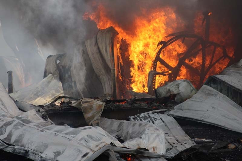 This photo reveals flames tearing through the Co-op building several hours after fire broke out.