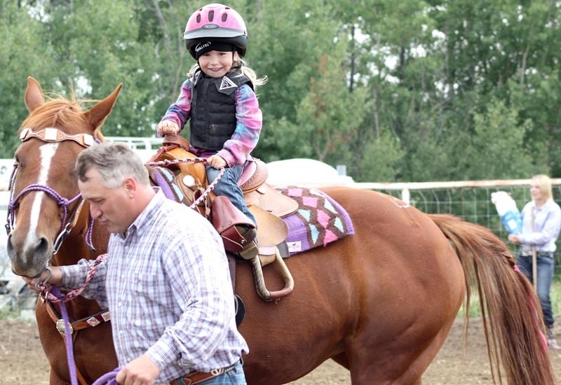 Maggie Cartwright is a picture of delight as dad, Kelly, leads her horse in this pre-peewee event. Saturday &#8216;s gymkhana provided plenty of opportunities for youngsters