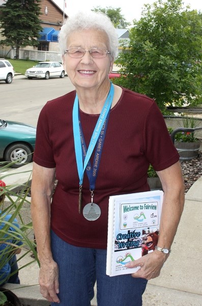 Barrhead&#8217;s bard: Elsie Measures with medals from previous provincial games draped around her neck.