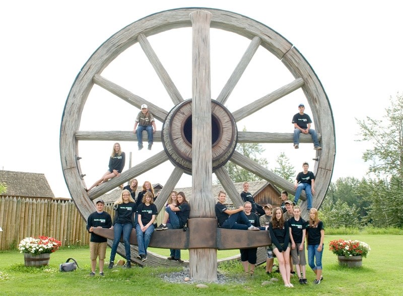 Club members from both Alberta and Ontario pose with Fort Assiniboine &#8216;s giant wagon wheel July 22. Jasper, Edmonton, Mayerthorpe and Barrhead were also on the agenda