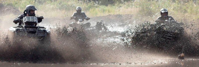 Mud, glorious mud: Three quad rodeo competitors create a blizzard of water and mud as they head for home on Saturday at the fall edition of the Henry Battenfelder Memorial