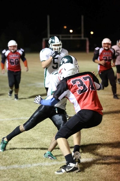 Logan Breitkreuz tackles an Athabasca player in the second quarter.