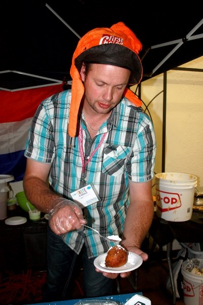 Cultural feast: Dennis Donkers serves a Dutch New Year &#8216;s treat, Oliebollen.