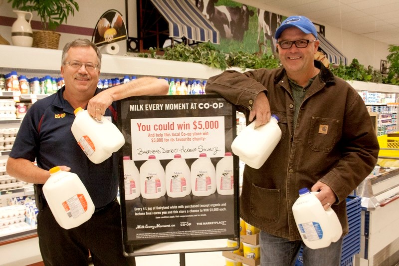 Barrhead Co-op food division manager Kevin Steeves and Agrena Society president Shannon Carlson promote the &#8220;Milk Every Moment At Co-op &#8221; contest.