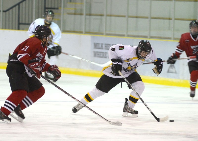 Barrhead Steelers player Brad Bujold battles for the puck against the Whitecourt Canadian Tire Wolverines Friday, Oct. 18. The Steelers claimed a victory in their third game