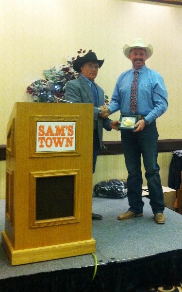 Barrhead cowboy Darcy Miller accepted his championship buckle after claiming the 2013 World Senior Pro Steer Wrestling title.