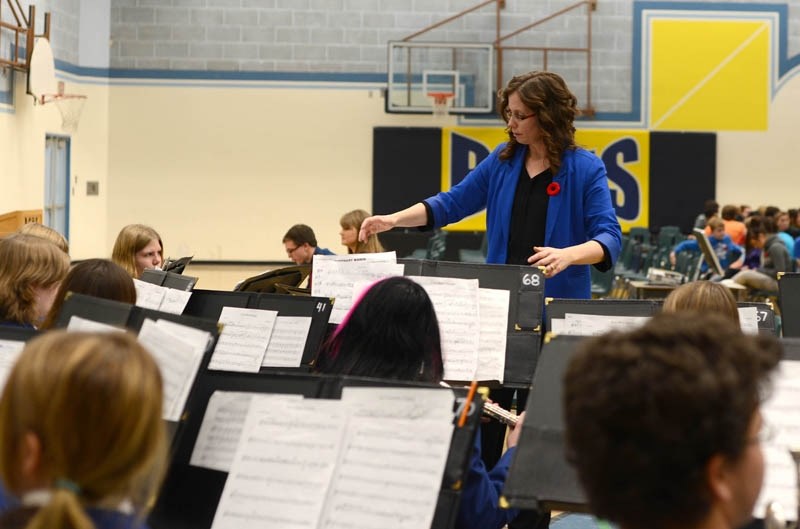 Barrhead Composite High School band director Kerri-Lee Kostiw conducts the band during the recent Remembrance Day service. The band program will be performing at the BCHS