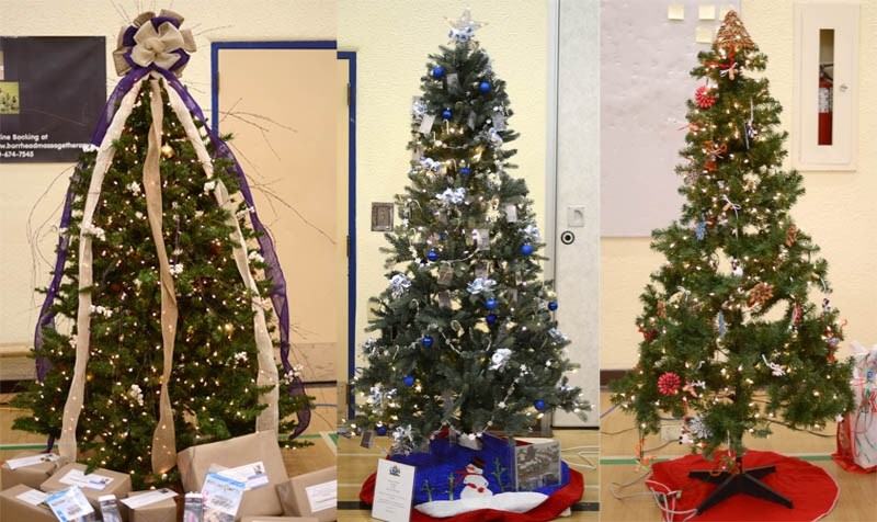 There were 20 beautiful and festive trees, wreathes and Christmas items donated for the Chamber of Commerce Christmas Gala auction Nov. 30. Pictured are the top three selling 