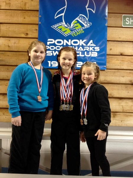 Swimming success: Pictured, left to right, with their medals are swimmers Ashlee Laing, Sydney Miller and Teagan Miller.