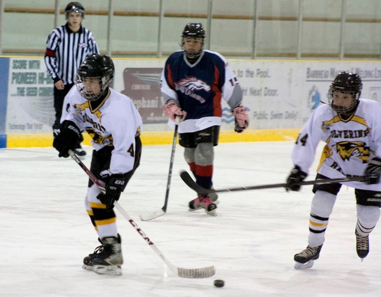 Damon Luciuk looks up for a teammate during Wolverines &#8216; 5-5 tie against Sturgeon at the Agrena.