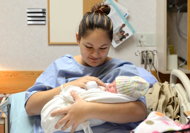Taylor Wilson cradles her newborn daughter Keelie Darlene Wilson, Barrhead &#8216;s first baby of 2014. Keelie was born at 5:24 p.m. on Jan. 1, at Barrhead Hospital Jan. 2.