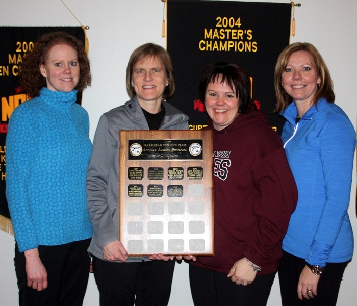 2014 Ladies Bonspiel champions: Members of team Bandola (left to right), Karla Montgomery, Sonja DeWaal, Tammy Caughlin and Lori Bandola with the winning plaque.
