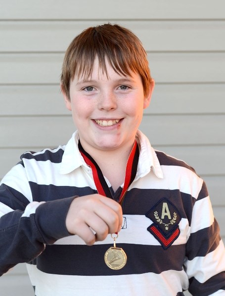 Twelve-year-old Patrick Heida had a bright grin to match the shiny new medal he took home for his performance at a speed skating competition in Red Deer Jan. 25-26. The
