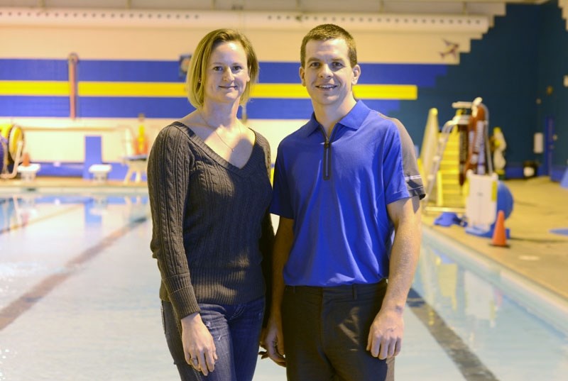 Queen of Hearts participant and committee member Tonya Card, and race director and committee member Murray Tuininga, stand at the edge of the pool that the triathlon depended 