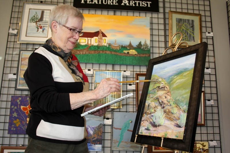 Barrhead Art Club &#8216;s artist of the month for March, Roberta Peirson, is pictured working on her painting &#8220;Drum &#8216;s Edge. &#8220;