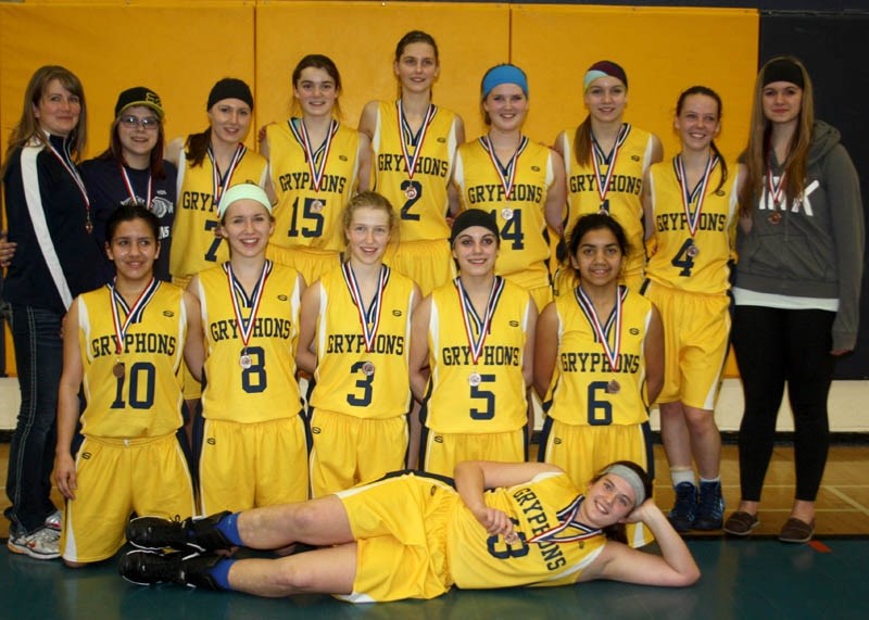 The senior girls Gryphons parade their bronze medals after the weekend zone tournament at Barrhead Composite High School. The players pictured are Jory Bielert, Feikje