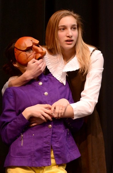 Maddy Dodds, playing perhaps the only normal character in the play, covers the mouth of Nikita Meunier as the two characters hide themselves away in a closet.