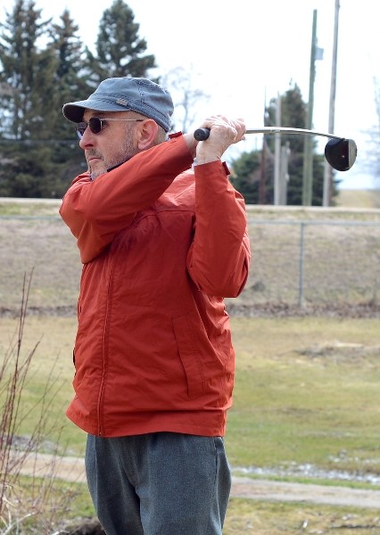 Golfers eager to get back on the course headed to Paddle River Golf and Country Club last week, after the greens were opened to members Easter Sunday. Alan Corke has already
