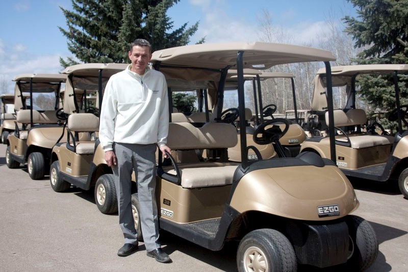 General manager and head pro Danny Grant with the club &#8216;s new fleet of champagne gold golf carts.